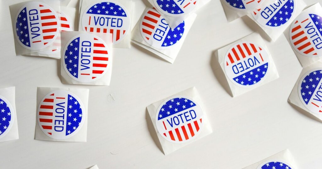 I Voted stickers arranged on a white surface