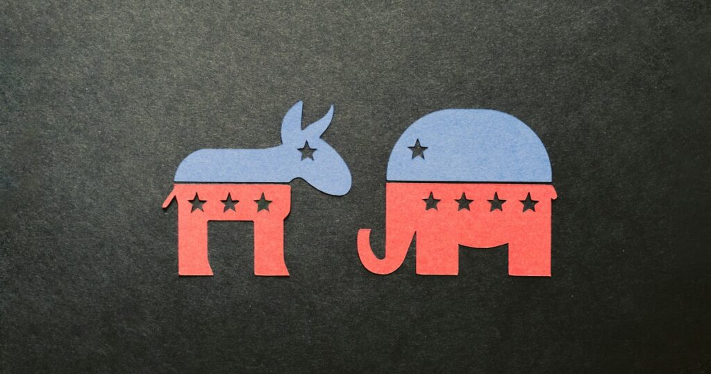 Paper cutouts of Republican and Democratic party symbols