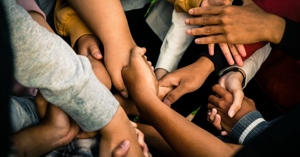 People joining hands together
